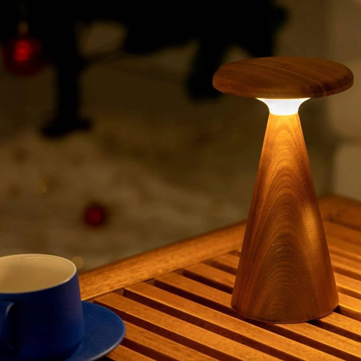 Wooden lamp on a wooden surface with a blurred background