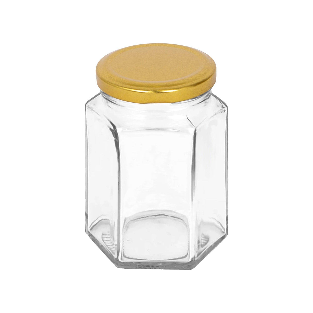 Clear hexagonal glass jar with a gold lid on a white background