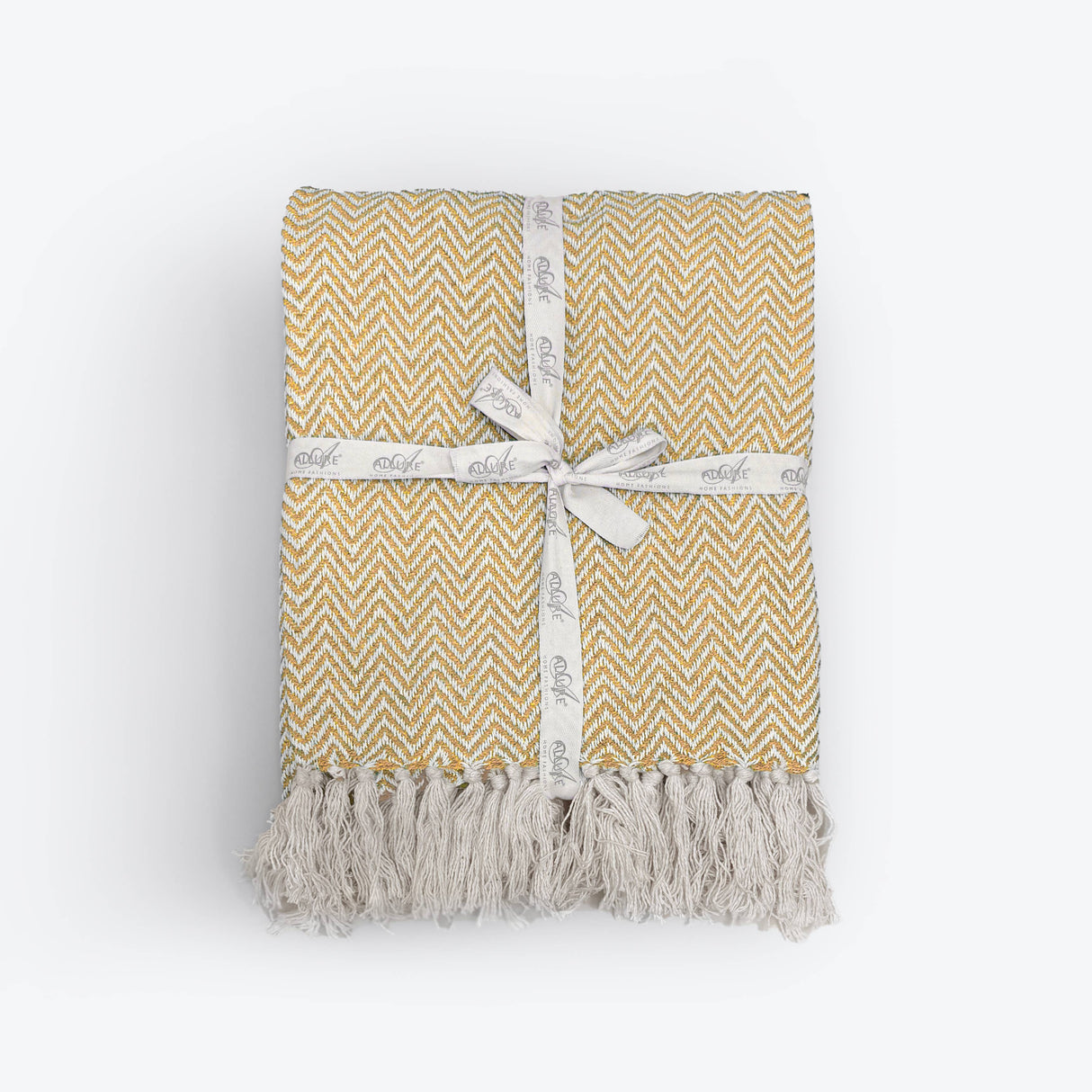 Yellow and white patterned blanket with tassels on a white background