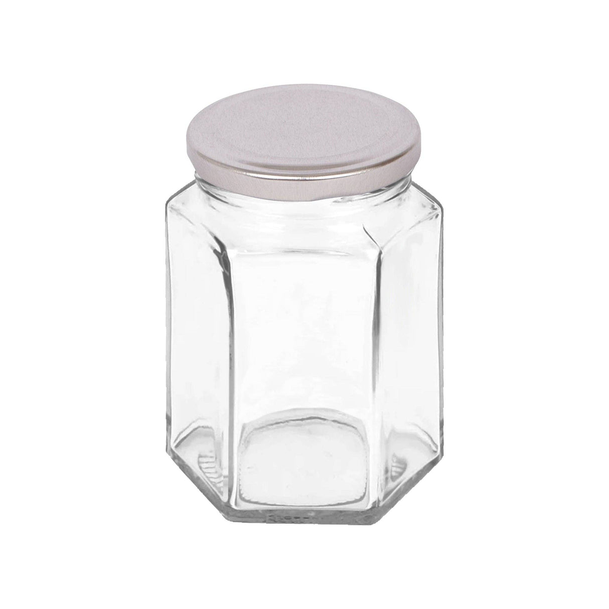 Hexagonal glass jar with a silver lid on a white background