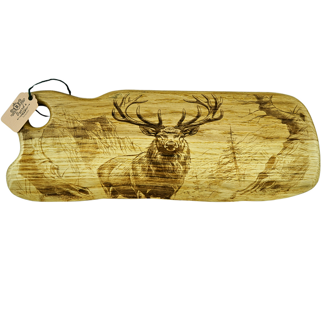 Wooden cutting board with deer engraving on a white background
