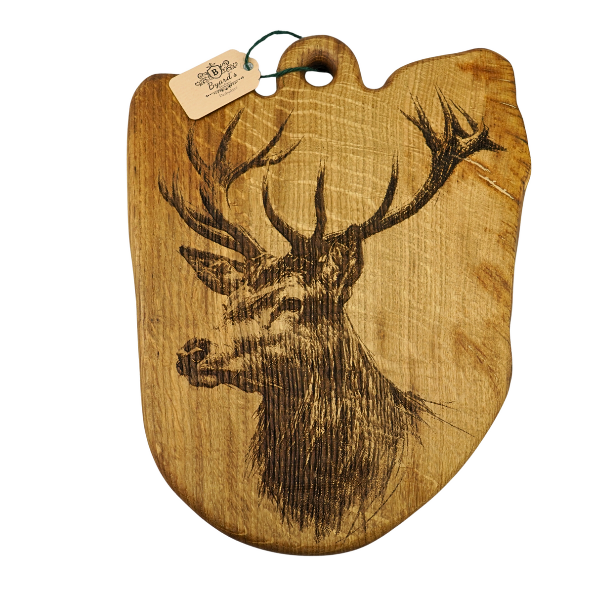 Wooden cutting board with deer head engraving on a white background