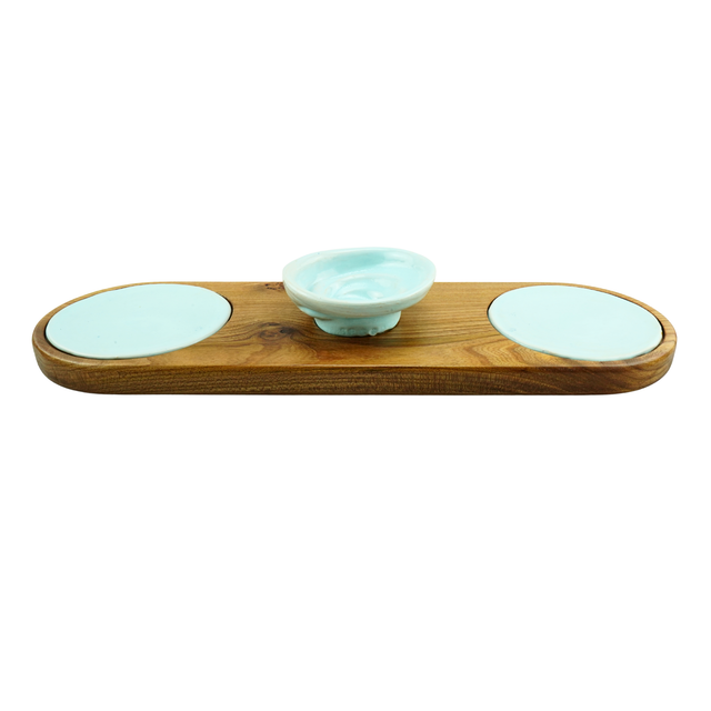 Wooden tray with three ceramic bowls on a white background