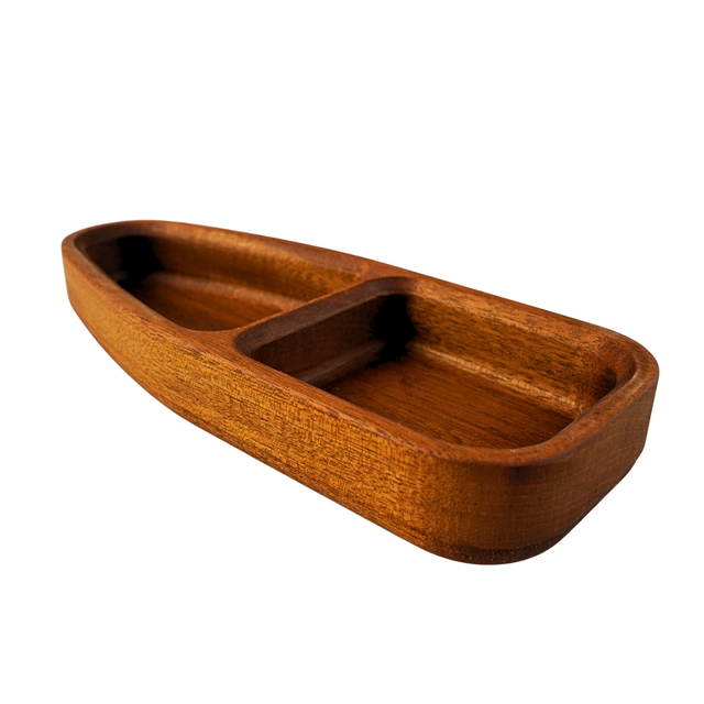 Wooden boat-shaped tray on a white background