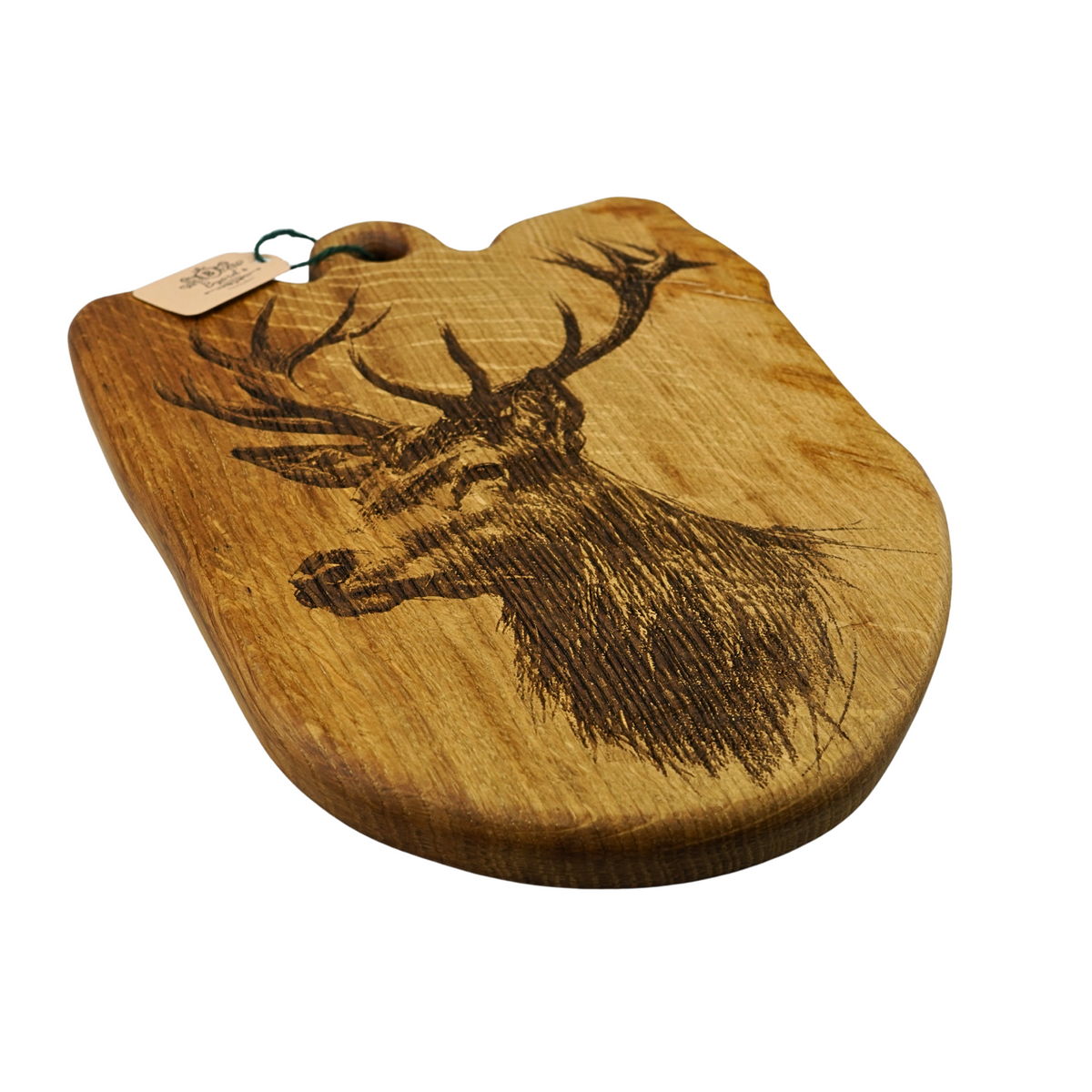 Wooden cutting board with engraved deer design on a white background