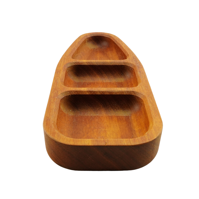 Wooden boat-shaped tray on a white background