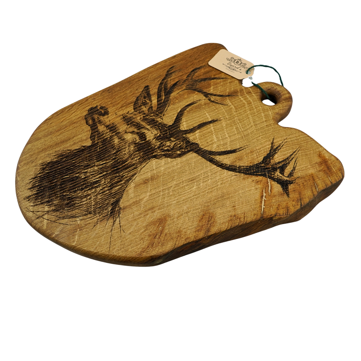Wooden cutting board with engraved design on a white background