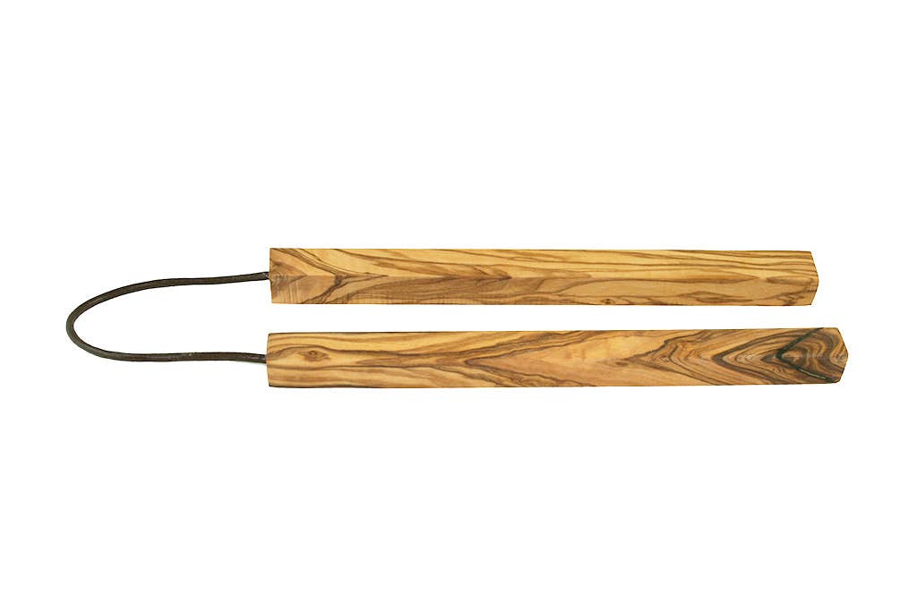 wooden trivet with a black cord on a white background