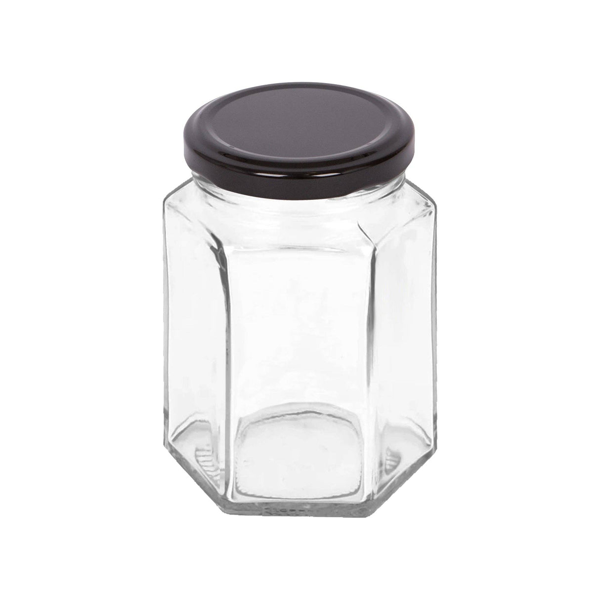Clear hexagonal glass jar with a black lid on a white background