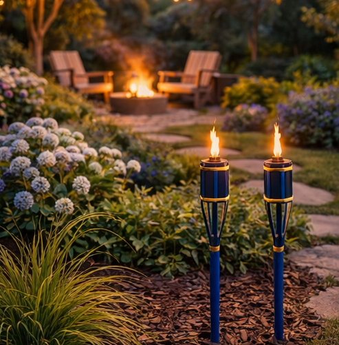 outdoor setting with blue torches illuminating garden