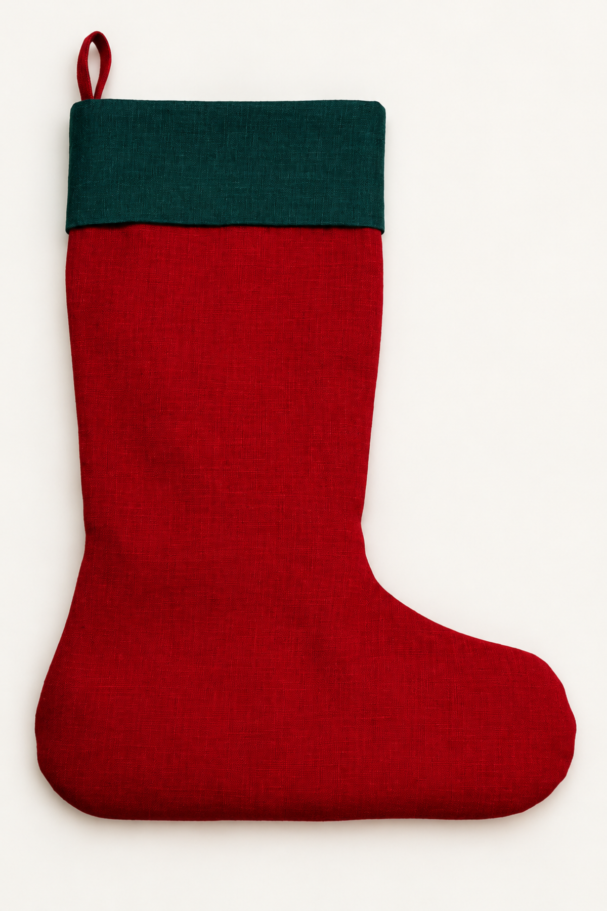 A red linen Christmas stocking with a dark green cuff and a hanging loop, shown against a plain off-white background.