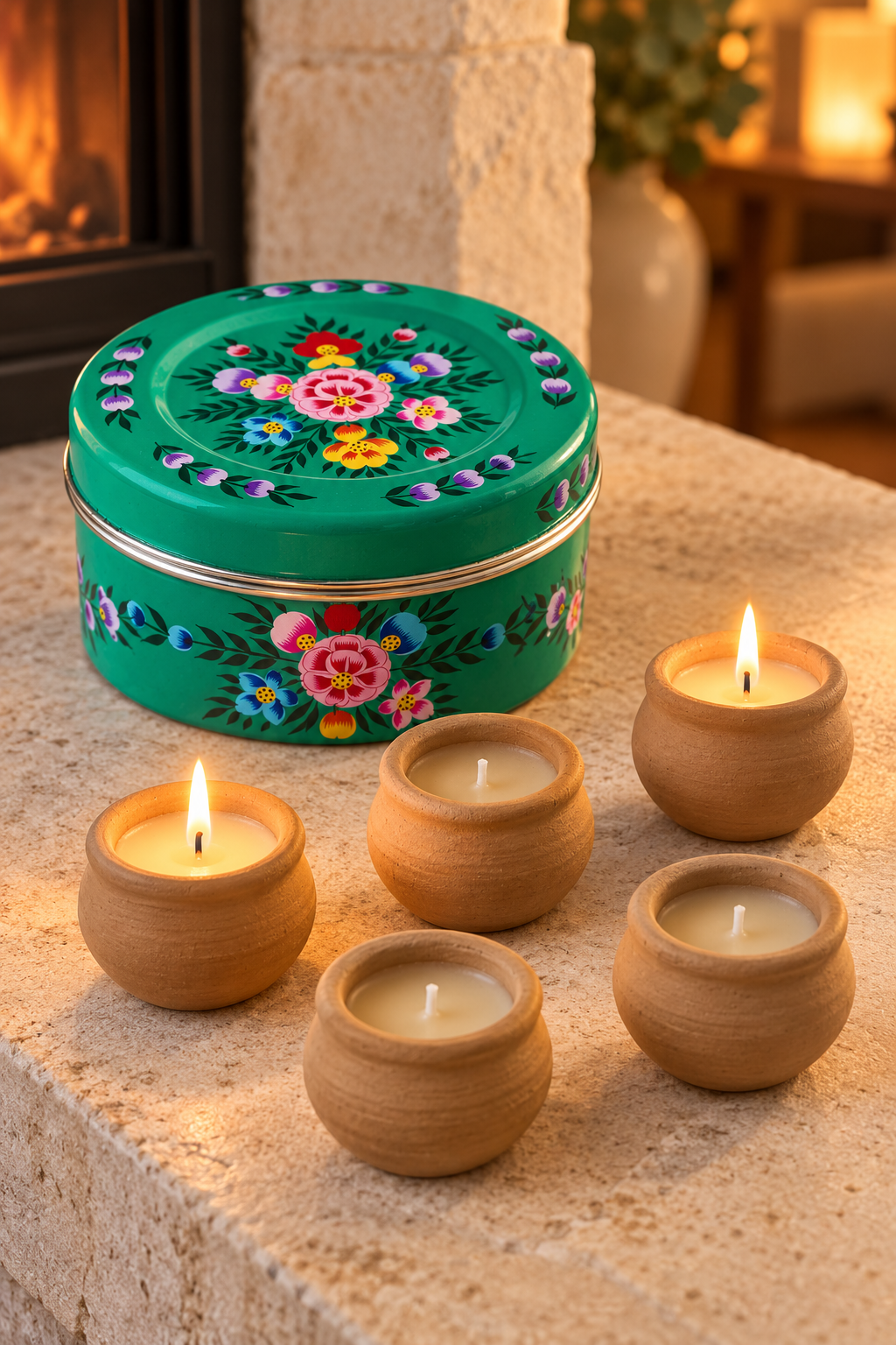 A floral tin to leave on show and five little candles to enjoy. Hand-painted in Kashmir, this green stainless steel container holds lavender-scented candles with a subtle hint of vanilla, hand-poured into terracotta pots. Reuse the empty tin for biscuits, sewing essentials or keepsakes