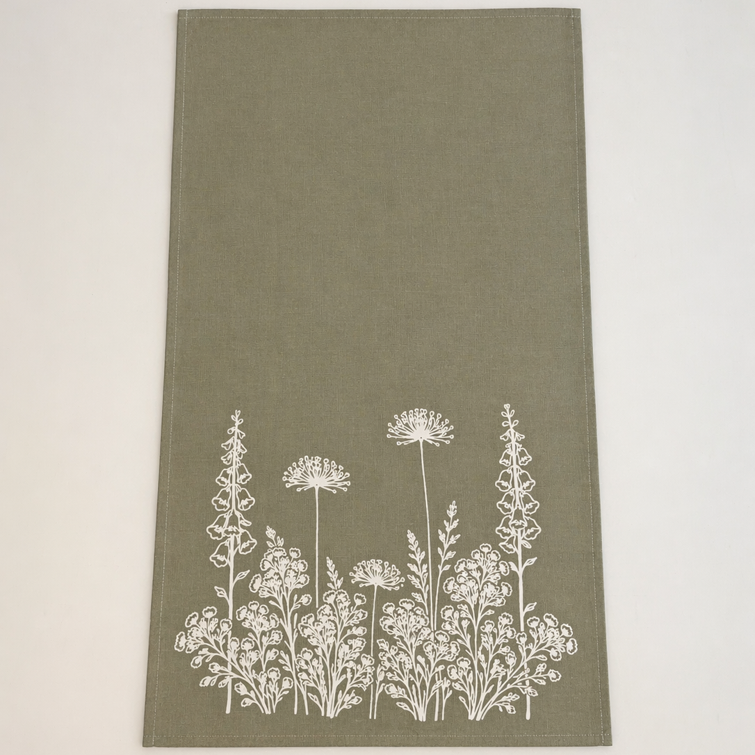Linen Sage Green towel with white floral pattern on a light beige background
