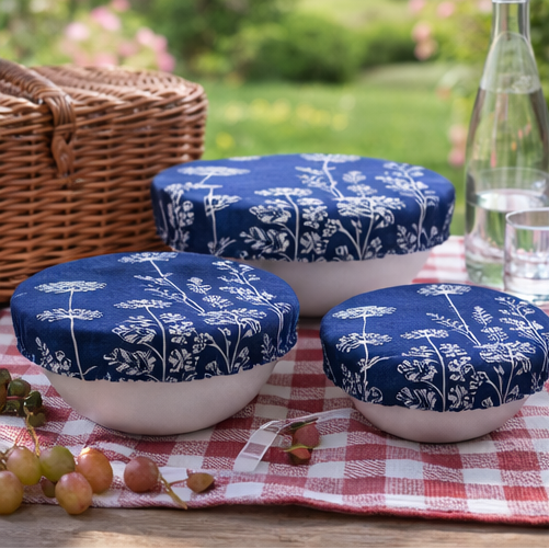 Collage of blue patterned lids on white bowls in various settings.