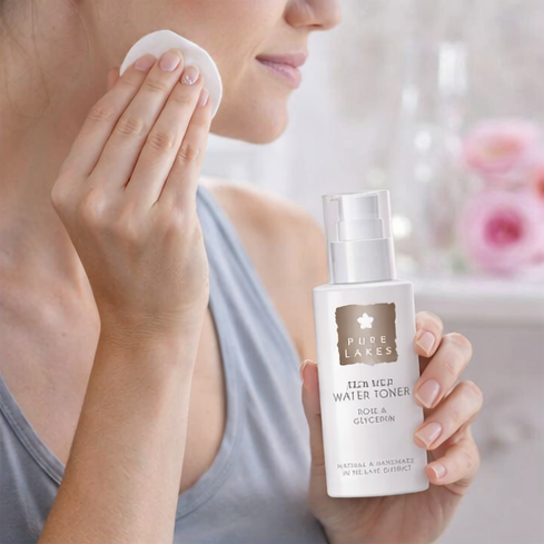 woman using Pure Lakes Flower Water Toner with floral background.