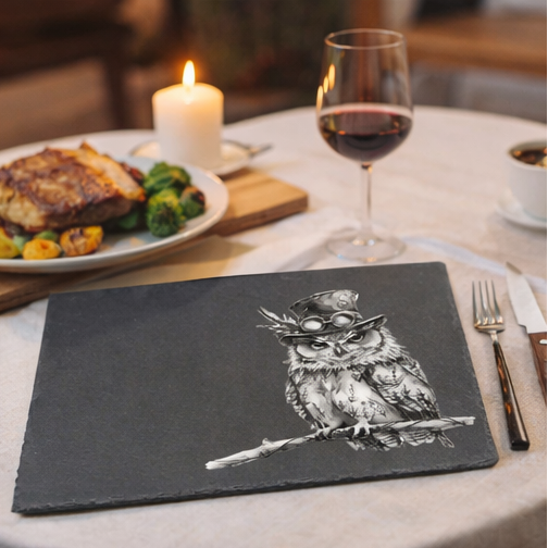 Slate placemats with owl design on a table,