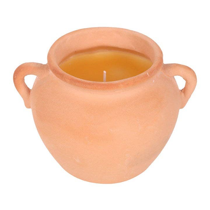 Terracotta pot candle with a white background