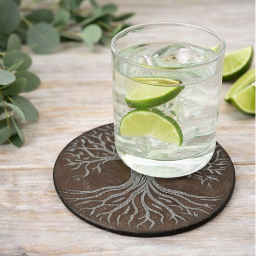 Set of four tree-patterned coasters with different backgrounds