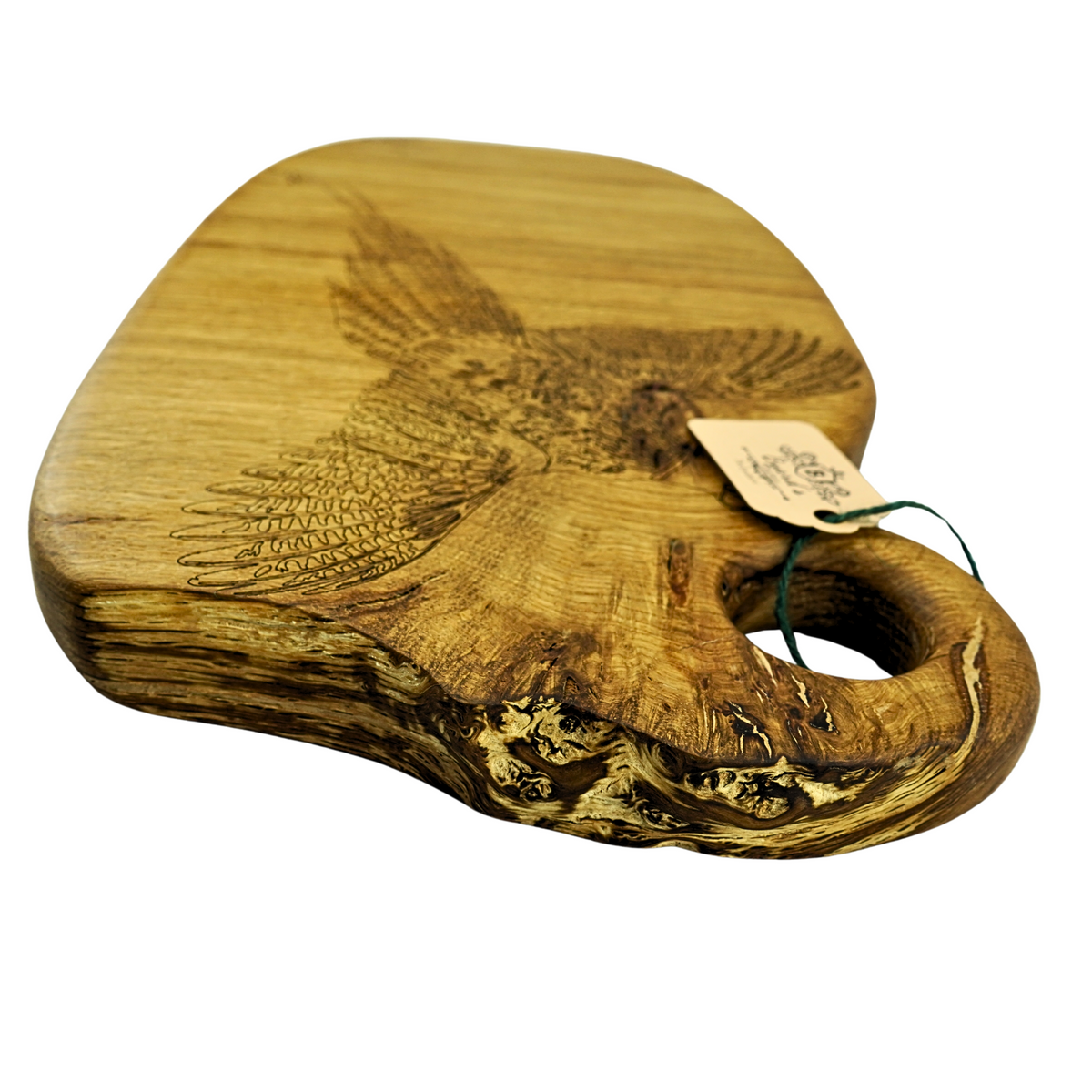 Wooden cutting board with engraved pheasant design and a tag on a white background