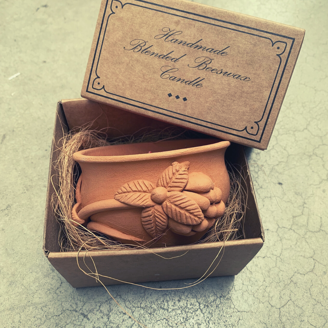 Handmade beeswax candle in a cardboard box with 'Handmade Blended Beeswax Candle' text.