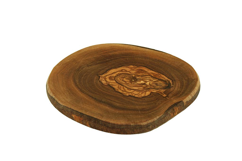 Wooden cutting board with a natural edge and engraved design on a white background