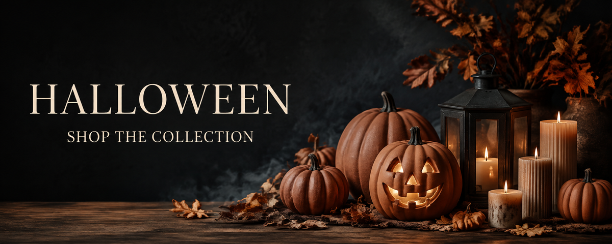 Halloween pumpkins, lanterns and candles beside the words Halloween, Shop the collection.