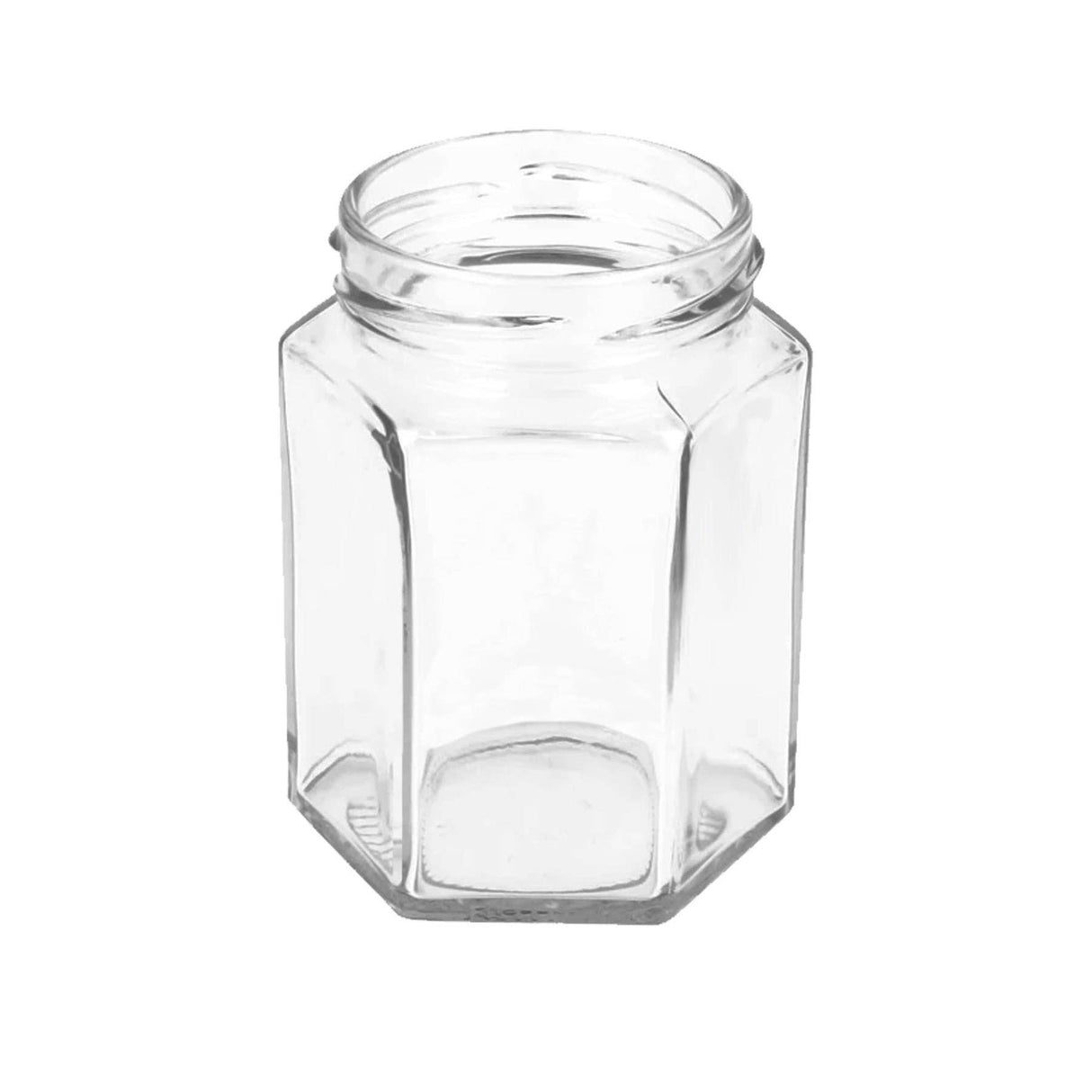 Clear hexagonal glass jar on a white background