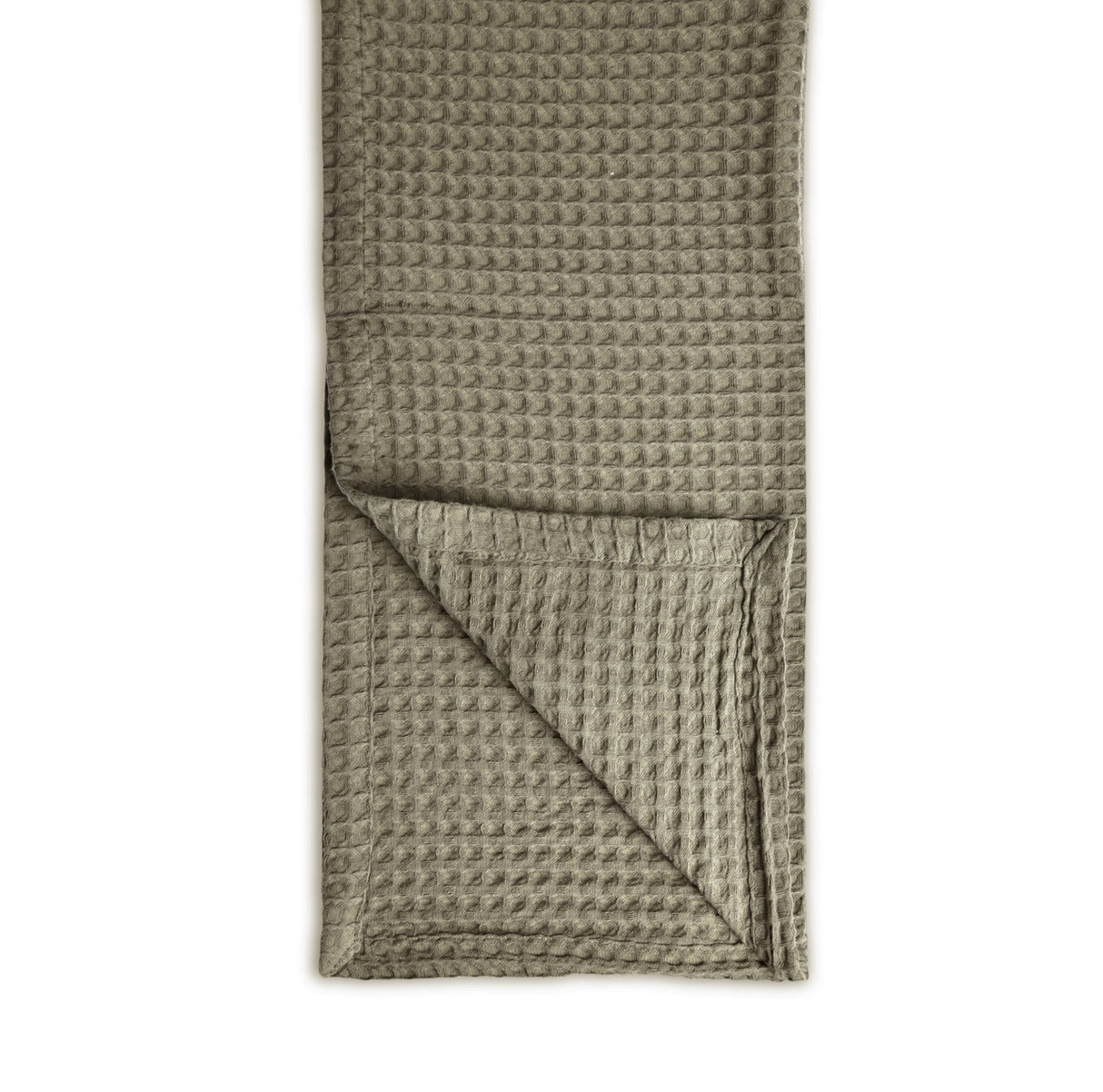 Waffle-textured throw 100% cotton folded neatly on a white background
