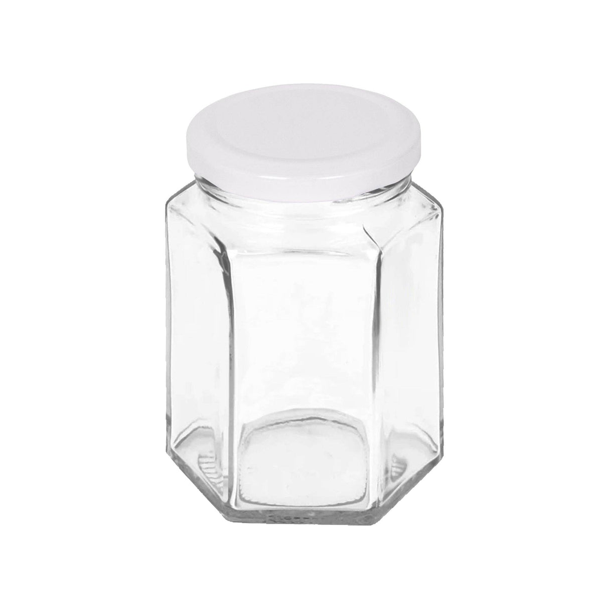 Hexagonal glass jar with a white lid on a white background