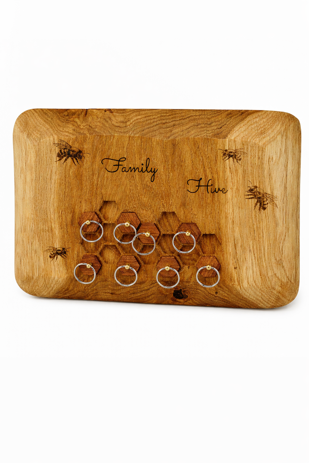 Wooden cutting board with honeycomb design and engraved text on a white background