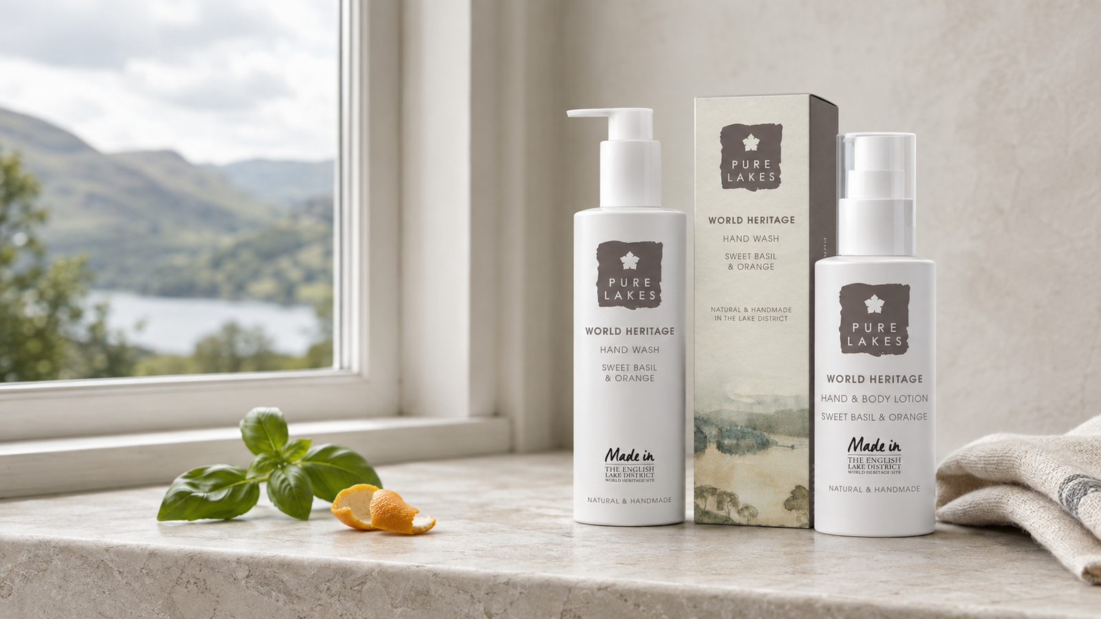 Pure Lakes natural hand wash and hand and body lotion beside a cottage window overlooking the Lake District.