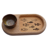 Wooden tray with fish designs and a bowl on a white background