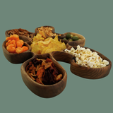 Set of wooden bowls with various snacks on a transparent background