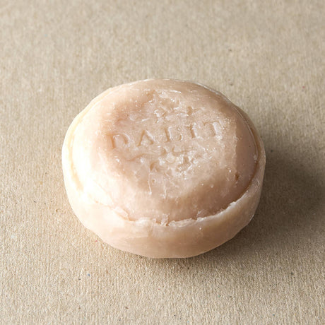 Bar of soap with 'DALIT' branding on a beige background