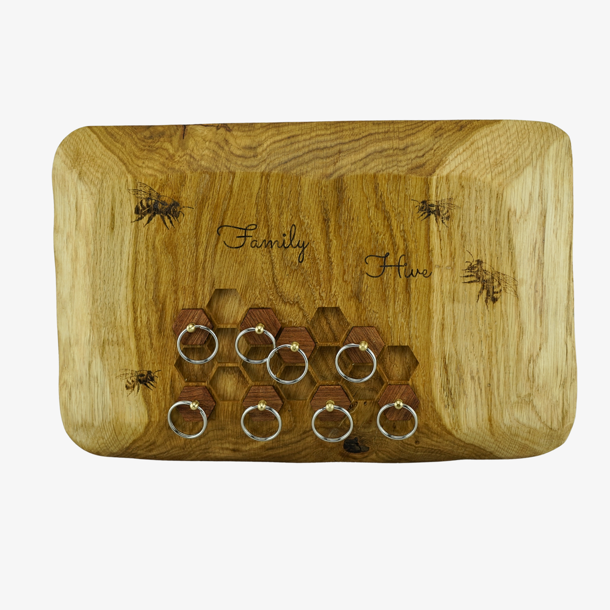 Wooden Key holder with key rings and 'Family Hive'  and bees engraving on a white background