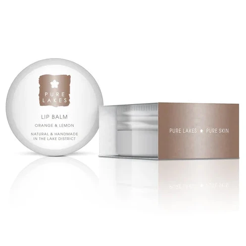 Lip balm and container with 'PURE Lakes' branding on a white background