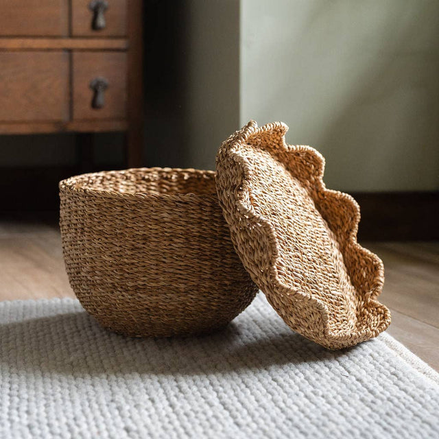 Woven basket with a textured cover on a light surface