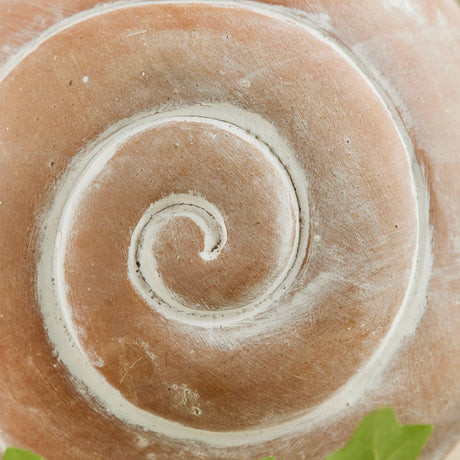 Ceramic pot with a spiral design on a natural background
