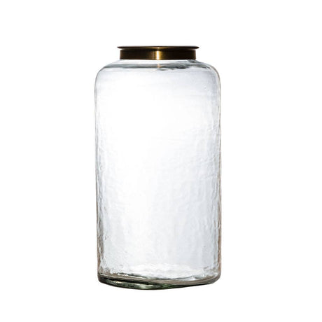 Clear glass jar with a gold lid on a white background