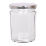 Clear glass jar with a silver metal lid on a white background