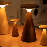 Set of wooden stool lights on a wooden surface.