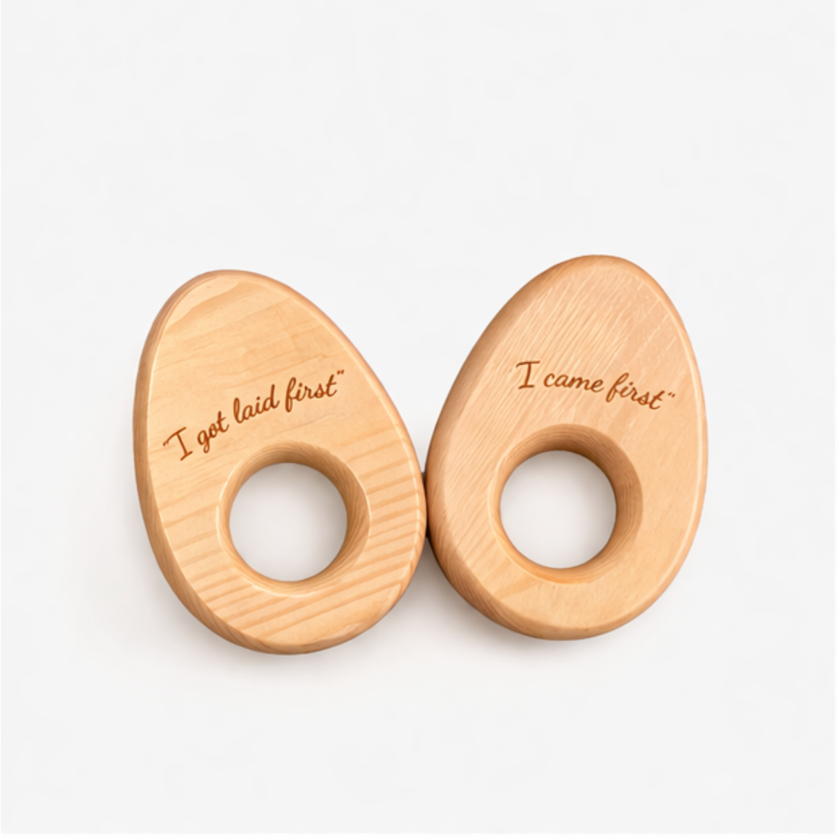 Two wooden objects with engraved text on a white background
