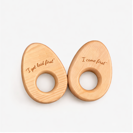 Two wooden objects with engraved text on a white background