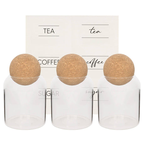 Set of three glass jars with cork lids labeled 'Tea', 'Coffee', and 'Sugar' on a white background.