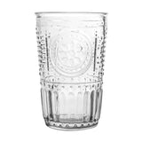 Clear glass tumbler with decorative pattern on a white background