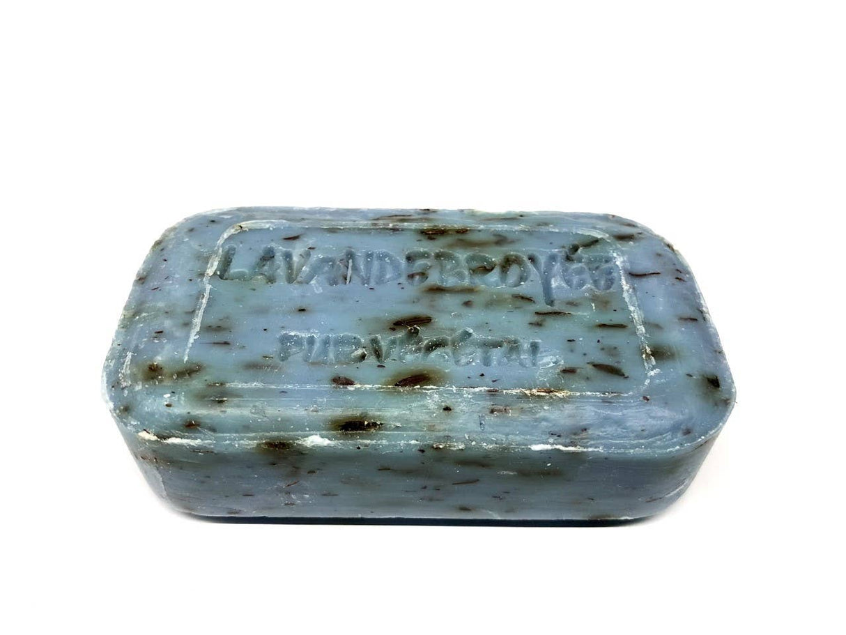 Bar of soap with speckled texture on a white background