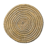 Round woven placemat with a spiral pattern on a white background