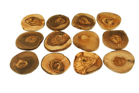 Set of wooden coasters with natural patterns on a white background