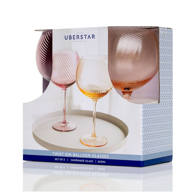 Box of Uberstar twist gin balloon glasses with two glasses inside.