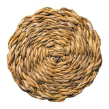 Round woven mat made of natural fibers on a white background